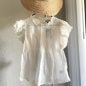 Pure cotton white blouse with Broderi at neck.